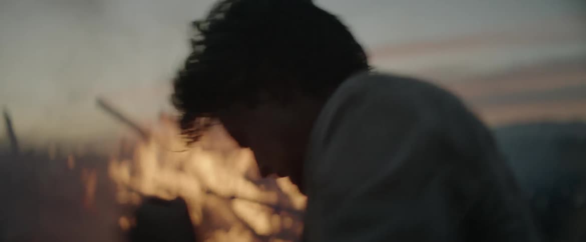 Two men attempt to extinguish a fire