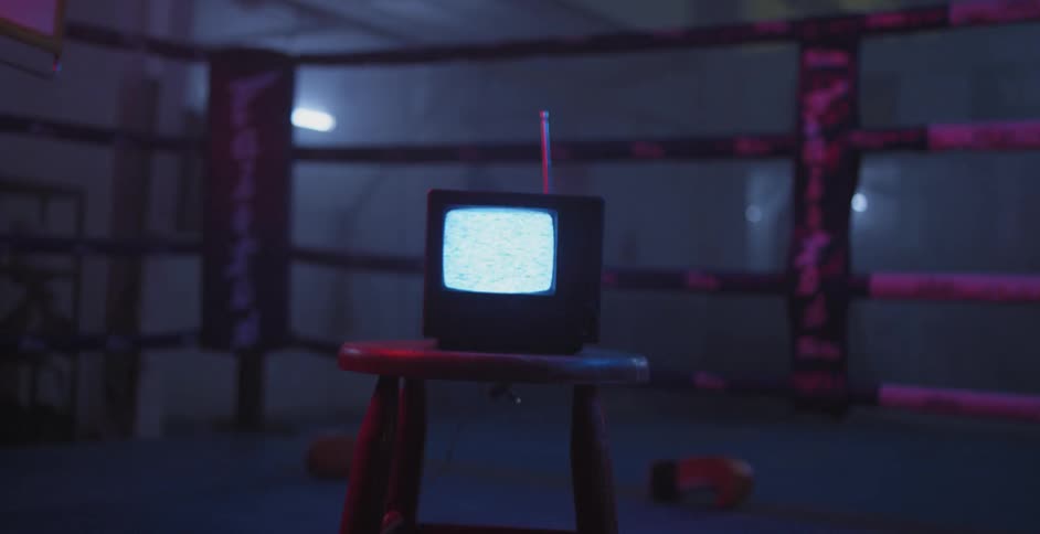 A television monitor is displayed in a boxing ring