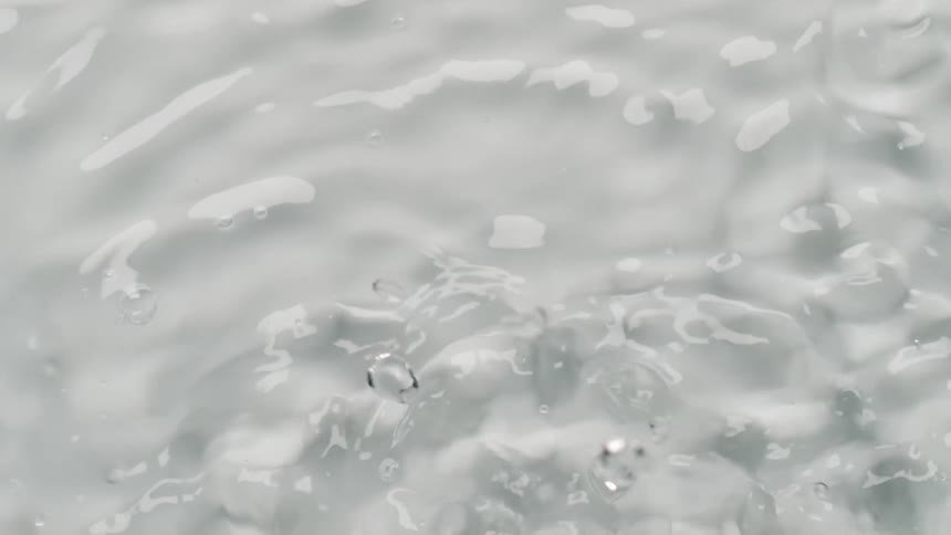 The clear water is splashed with waves moving