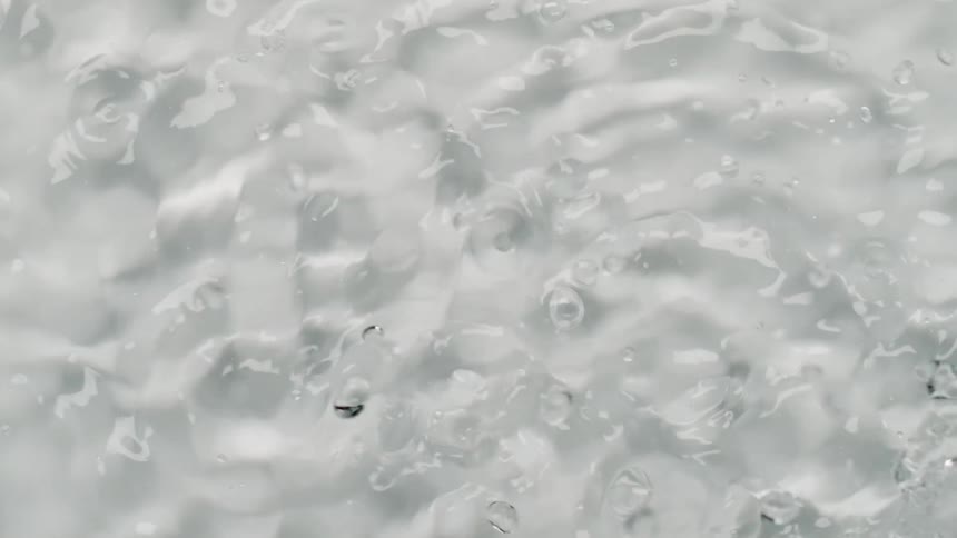 Droplets bounce and plop as they splash into liquid
