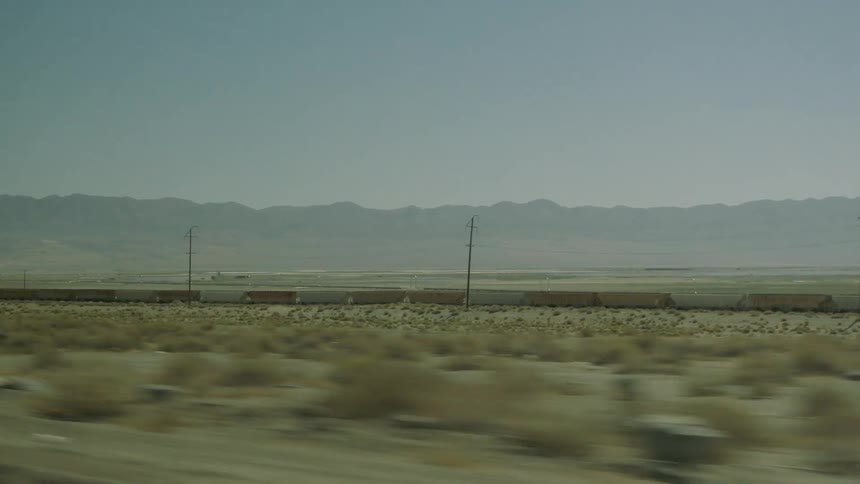The desert is lined with many power lines