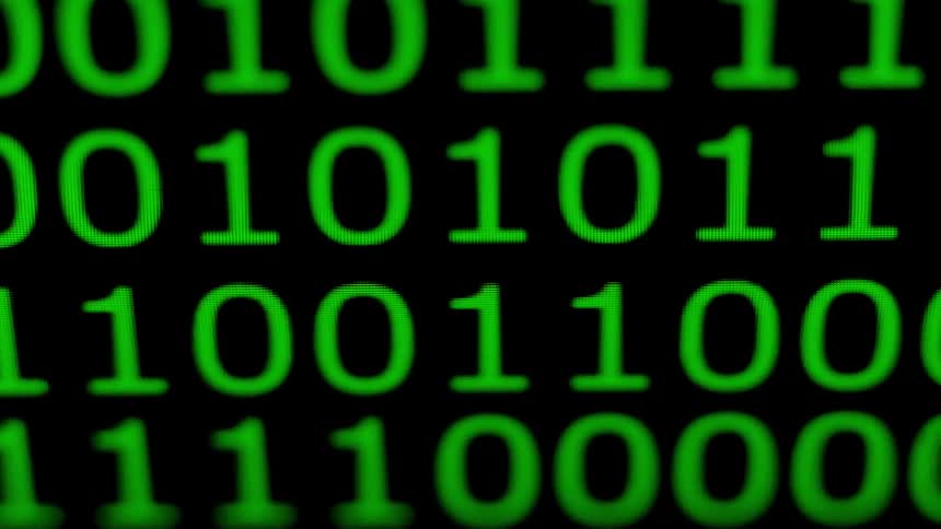 Rows of zeros and ones scroll across a computer screen