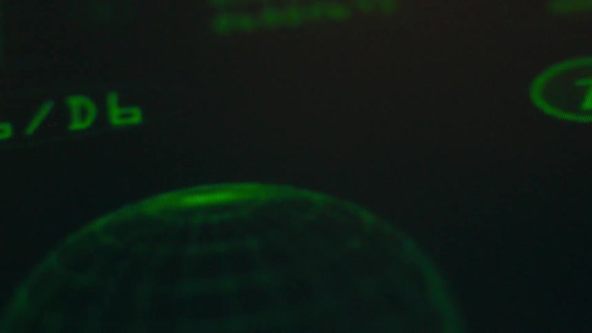 Green text and animation is shown on a screen