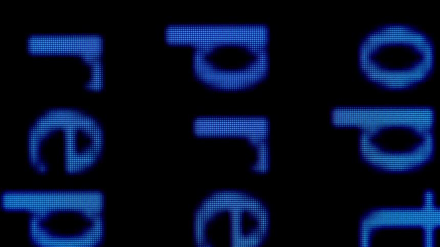 The computer screen has some words spelled out