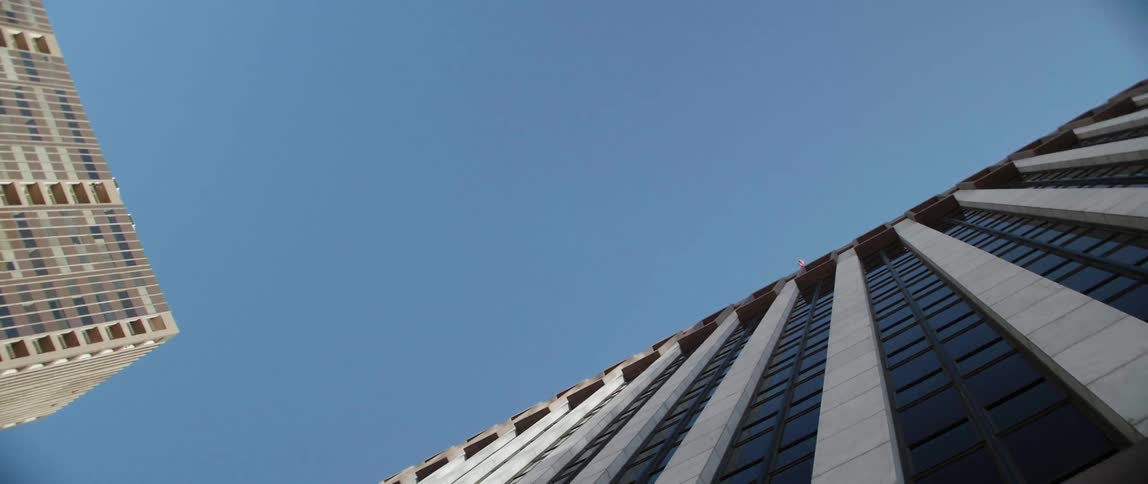A tall city building towards into the sky