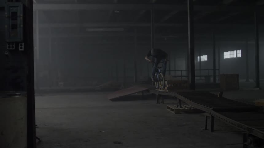 Man rides bicycle at indoor bicycle course
