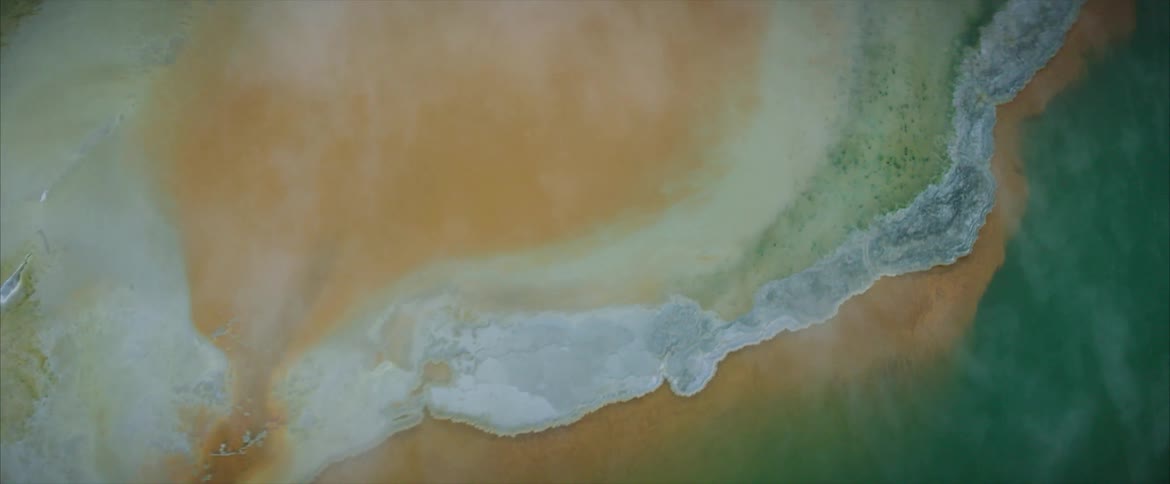 Steam pours from a hot spring