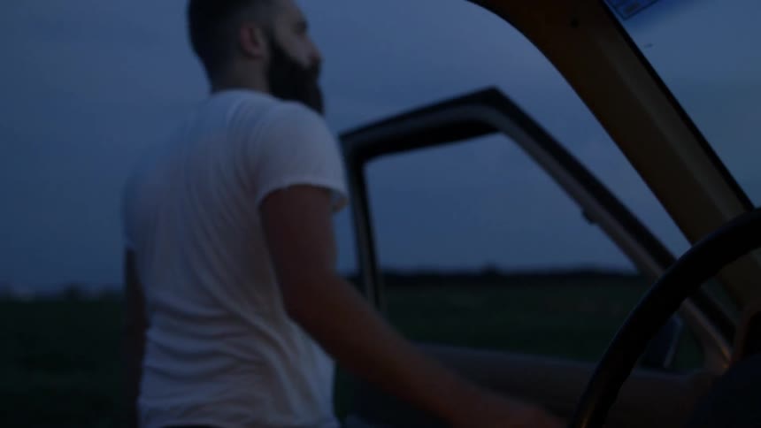 A man exits a truck
