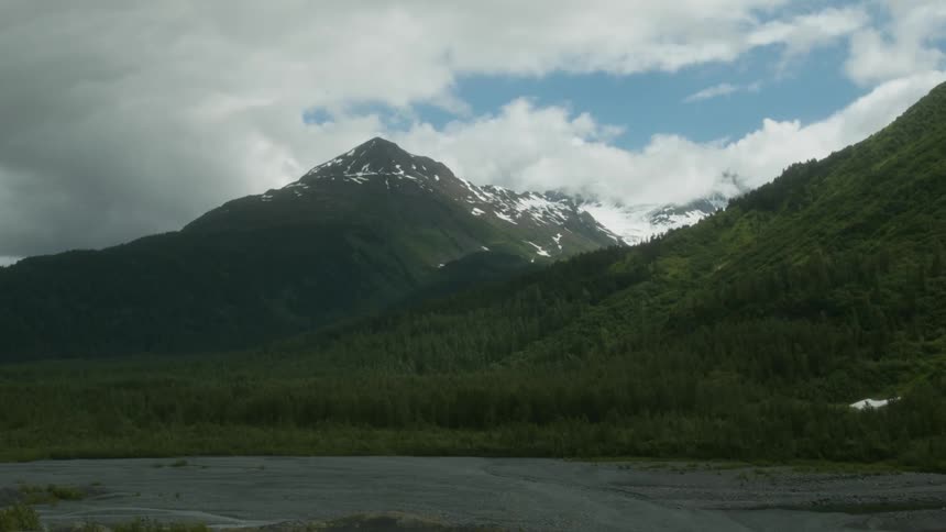 The mountain ahead has snow at the top