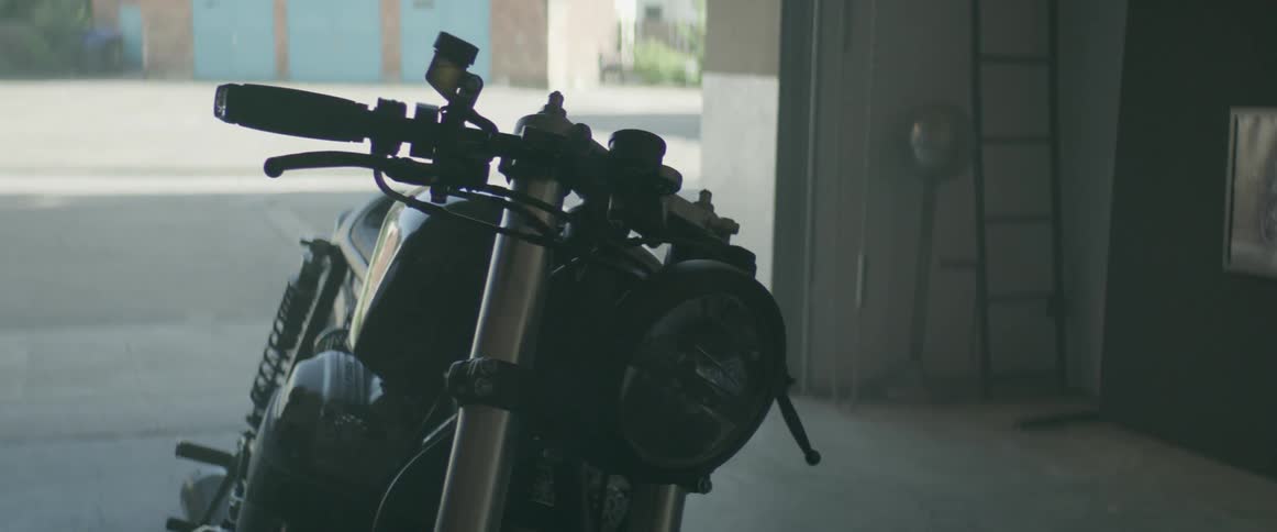A motorcycle is sitting in a garage
