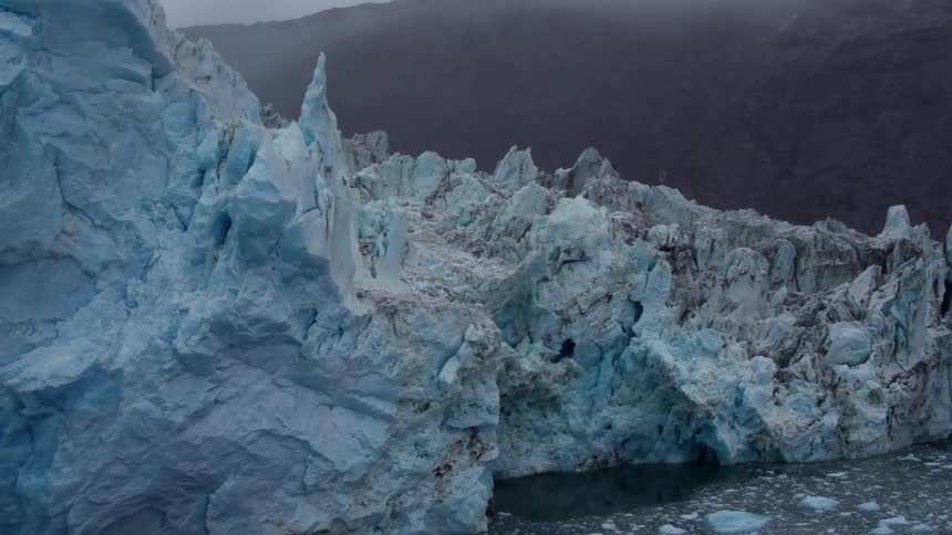 Glaciers tower over icy water