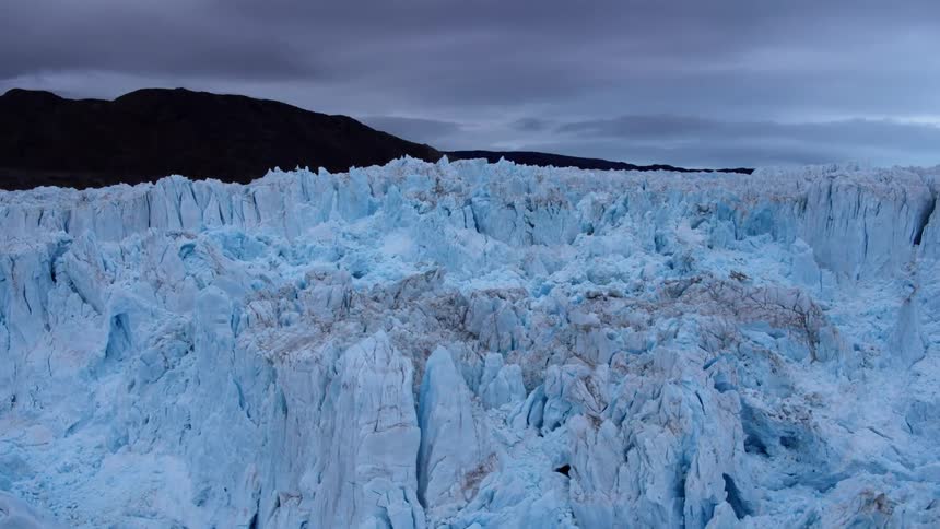 A large iceberg is being filmed