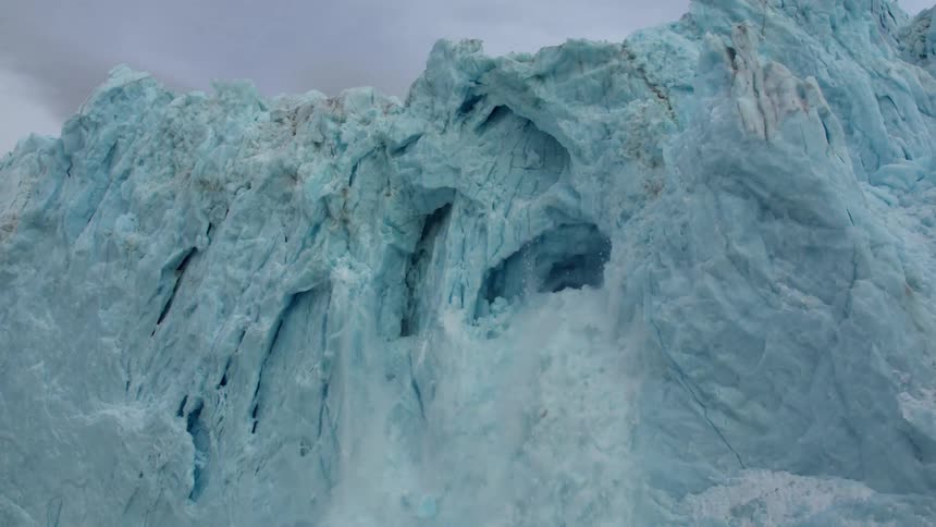 A large shelf of ice is collapsing