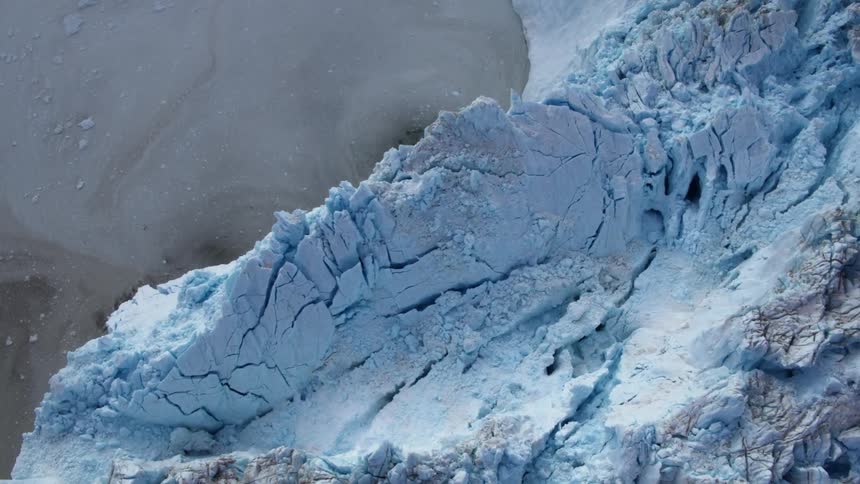 Glaciers tower over water in the wilderness
