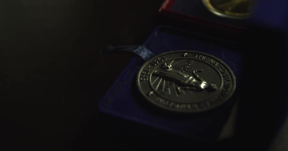 A medal in a blue box