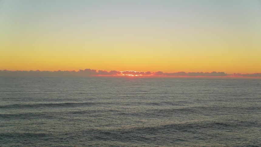 The sun sets on the ocean