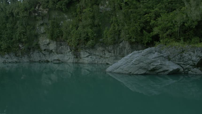 Trees surround a mountain lake