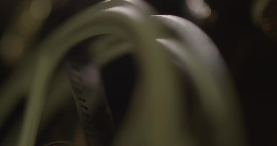 Closeup of a film reel turning on a working film projector
