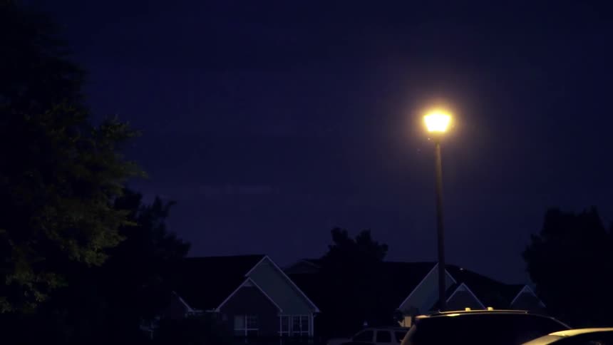 A lightning storm flashes in the night sky