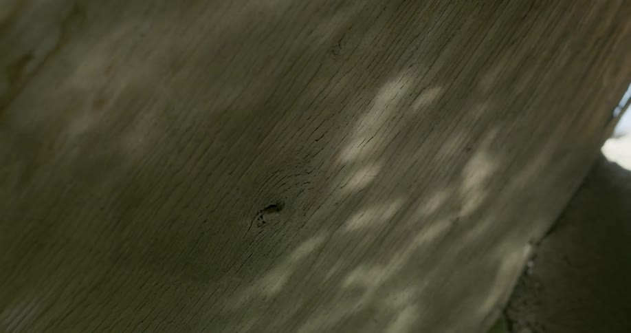 Water shadows dancing on a brown flat surface