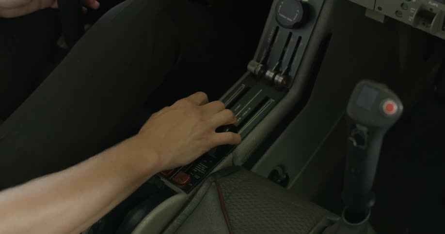 A person is pulling the levers in a vehicle