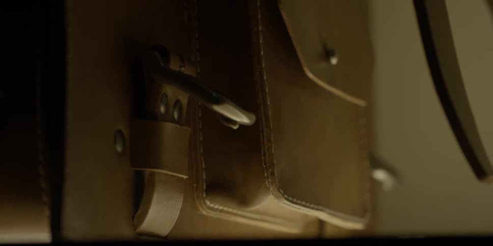 The latch on the bag is moving back and forth