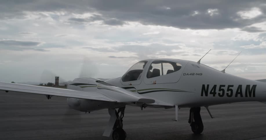 Propeller spins on small aircraft on tarmac