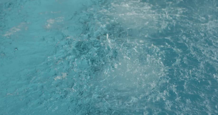 A woman is driving into a pool