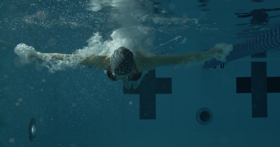 Woman dives into a pool