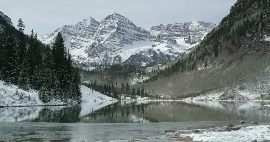 A lake is mirroring the mountain