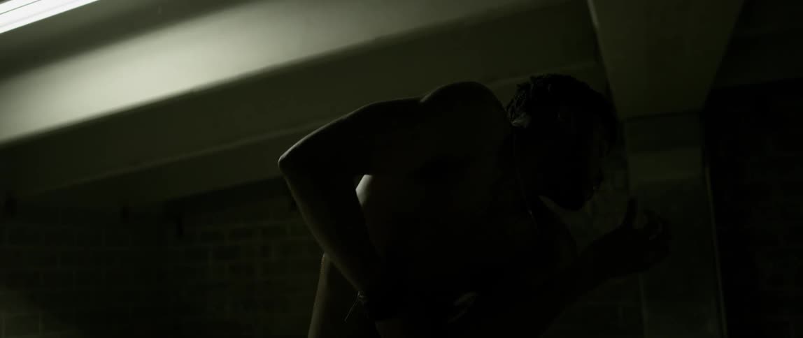 Man moving rhythmically in a dark area