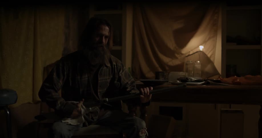 Man cleans his gun