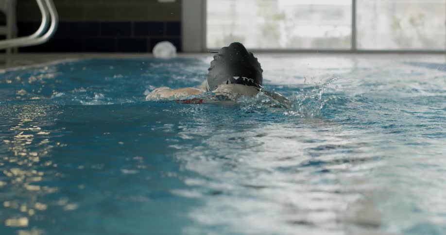 Woman swims in a pool
