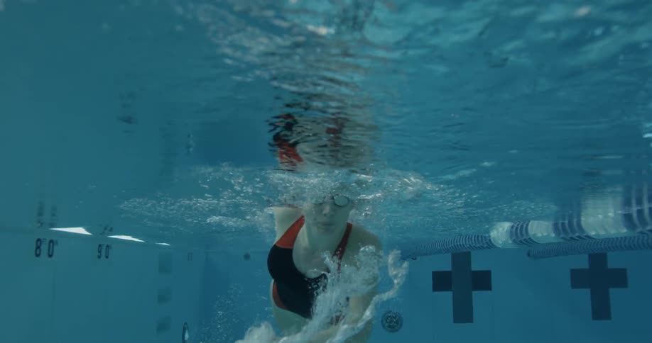 Woman swims in a public pool
