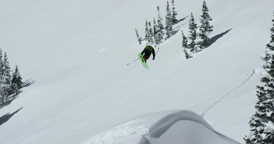 A skier is jumping and twisting in the air