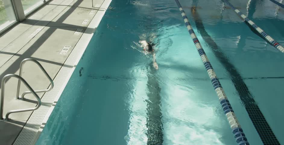 Woman dives into a pool