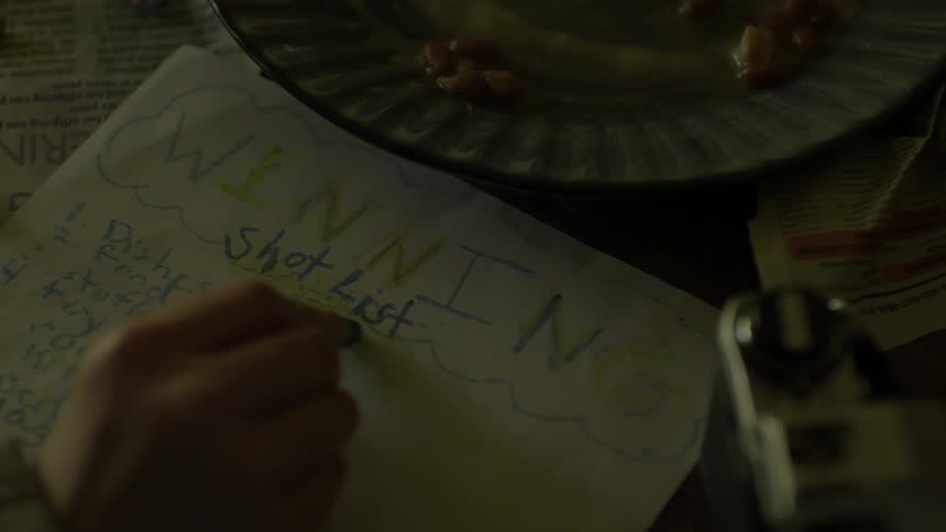 Person underlines writing with a crayon