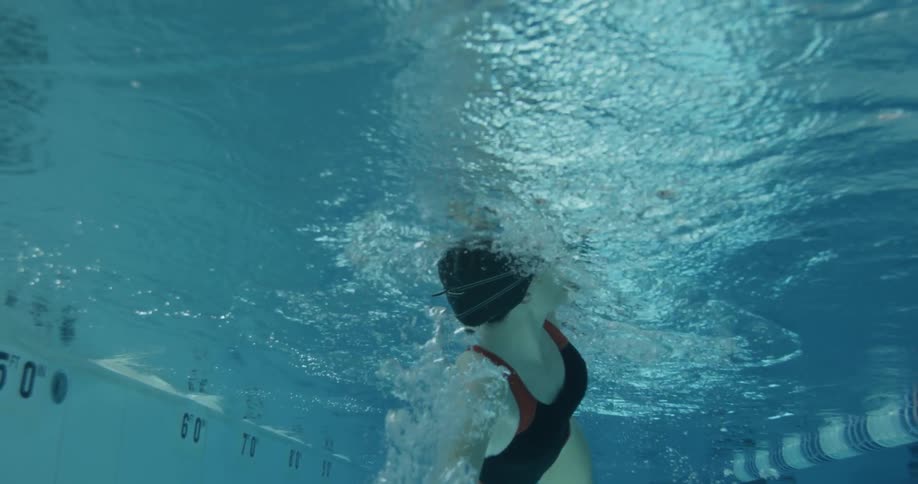 Woman swims in a pool
