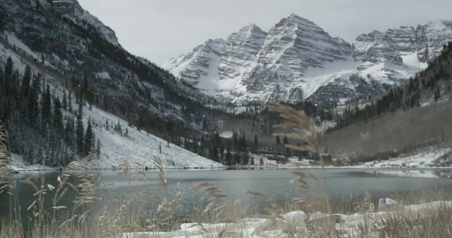 A snow covered mountain is shown in the distance