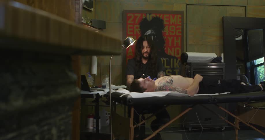A man is getting some new ink