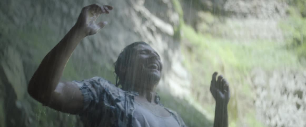 Man stands trembling in a rainstorm