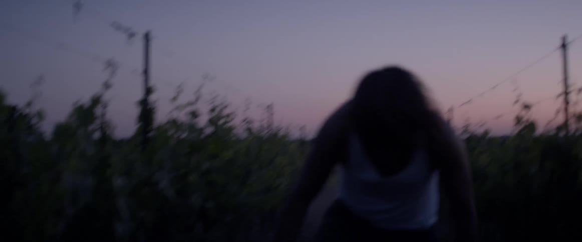 Man stumbles as he walks on a dirt path