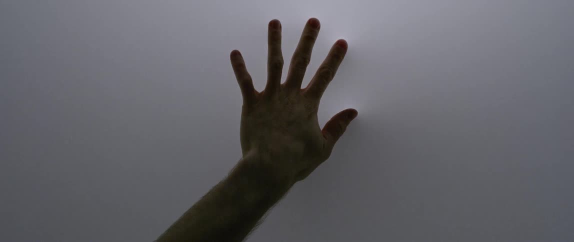 A woman stretches her hand out