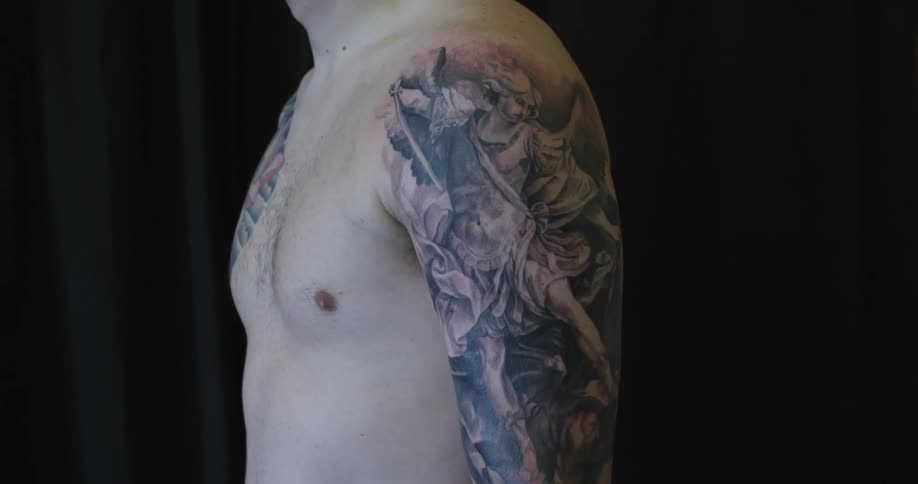 A person with a tattoo on their arm