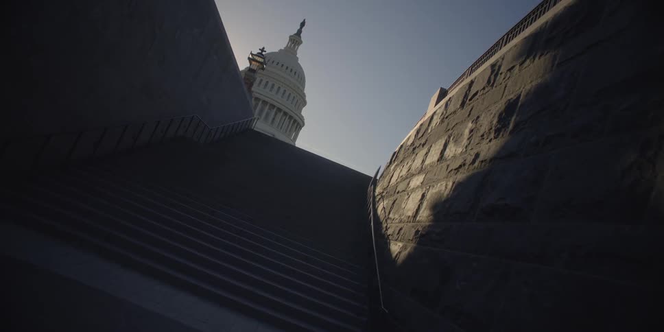 The dark stairwell leads up to a sunny sky