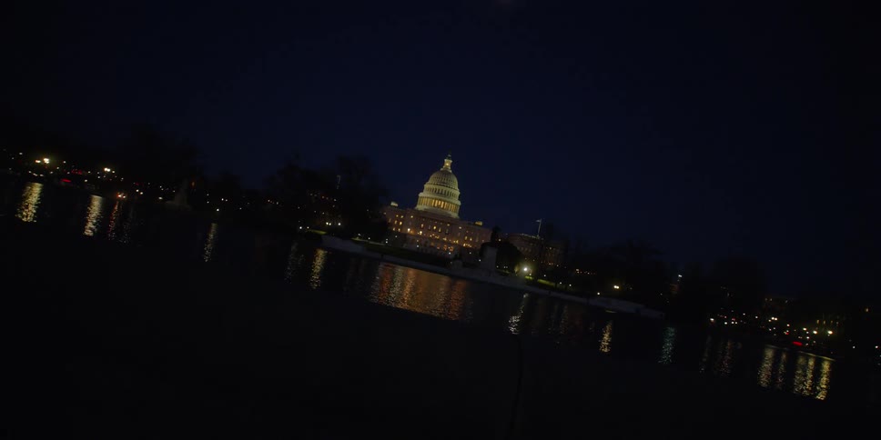 The us capitol building shines with lights at night