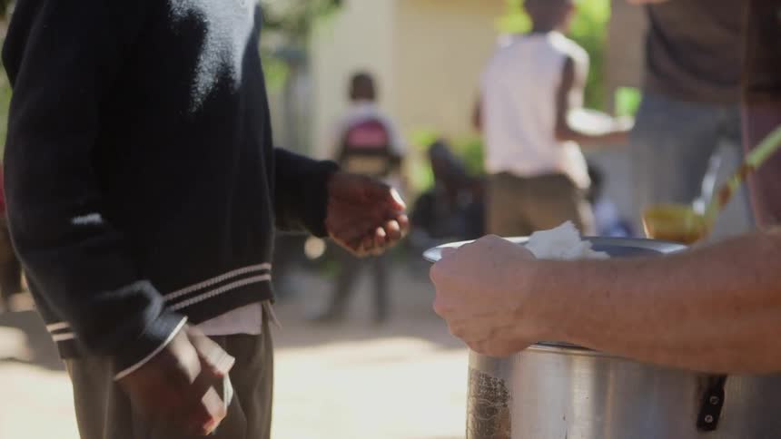 People serving food to people