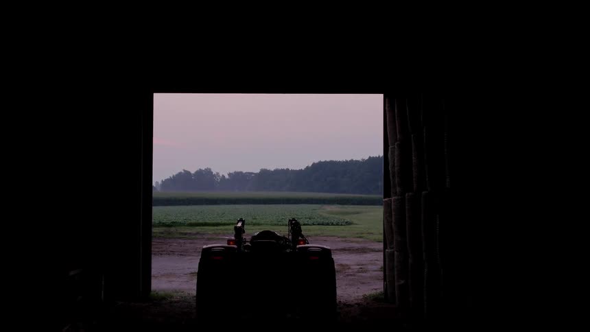 A farm and barn is viewed close up