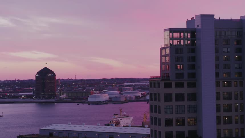 A lakeside city at sunrise