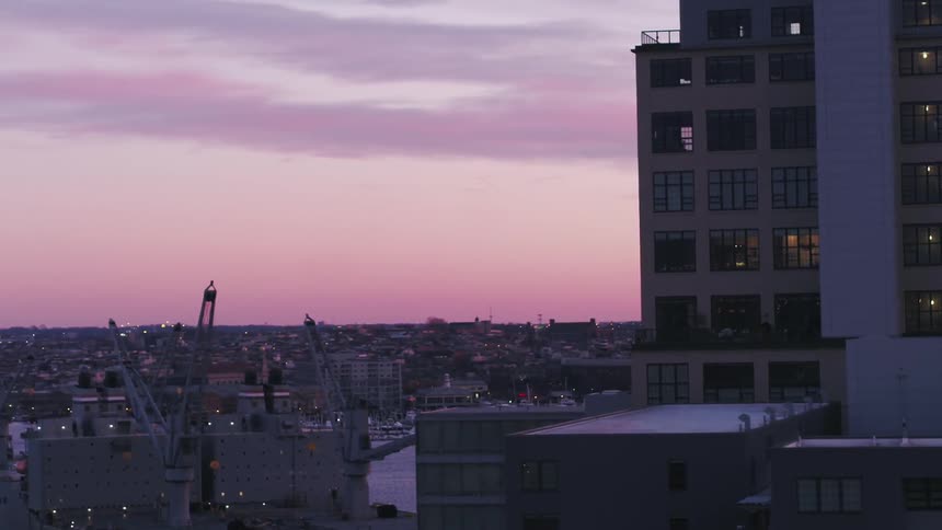 The sun sets over a city